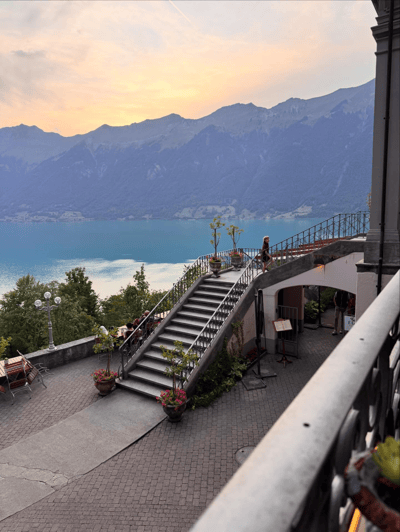 Grand hotel terrace overlooking Lake Brienz at sunset